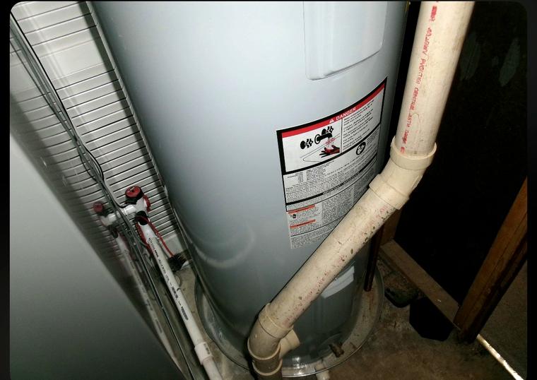 The original gas water heater before replacement