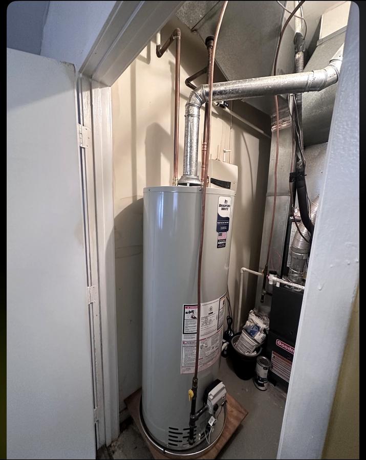 New Bradford White gas water heater installed with new copper lines and venting
